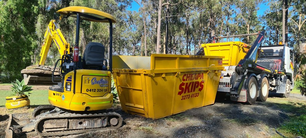 Tips For Efficient Skip Placement - Skip and construction equipment in garden