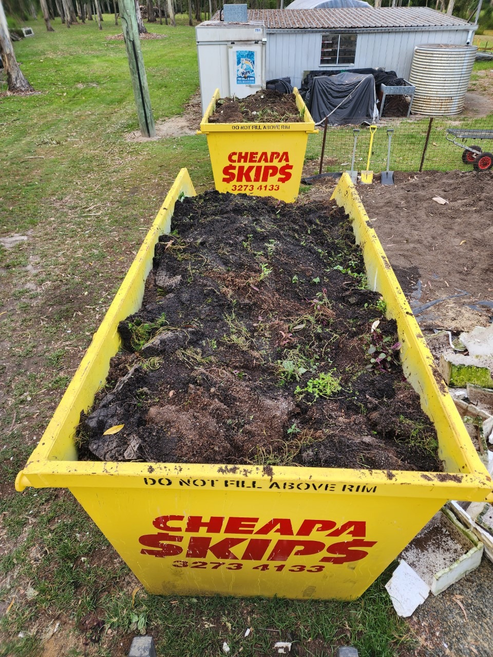 Green waste skip filled with soil in Redbank Plains