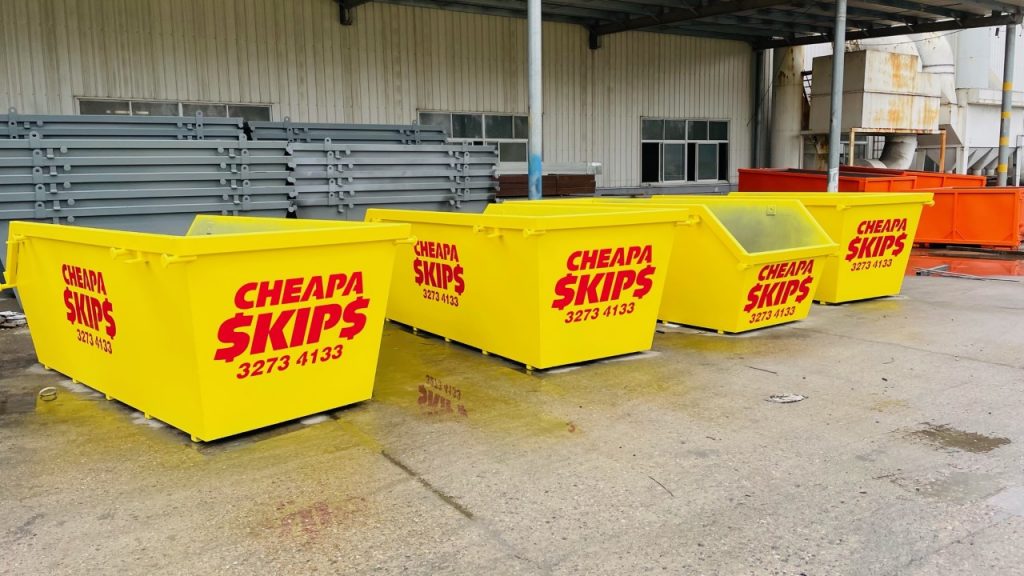 Tips For Efficient Skip Placement - line of yellow skips outside a building
